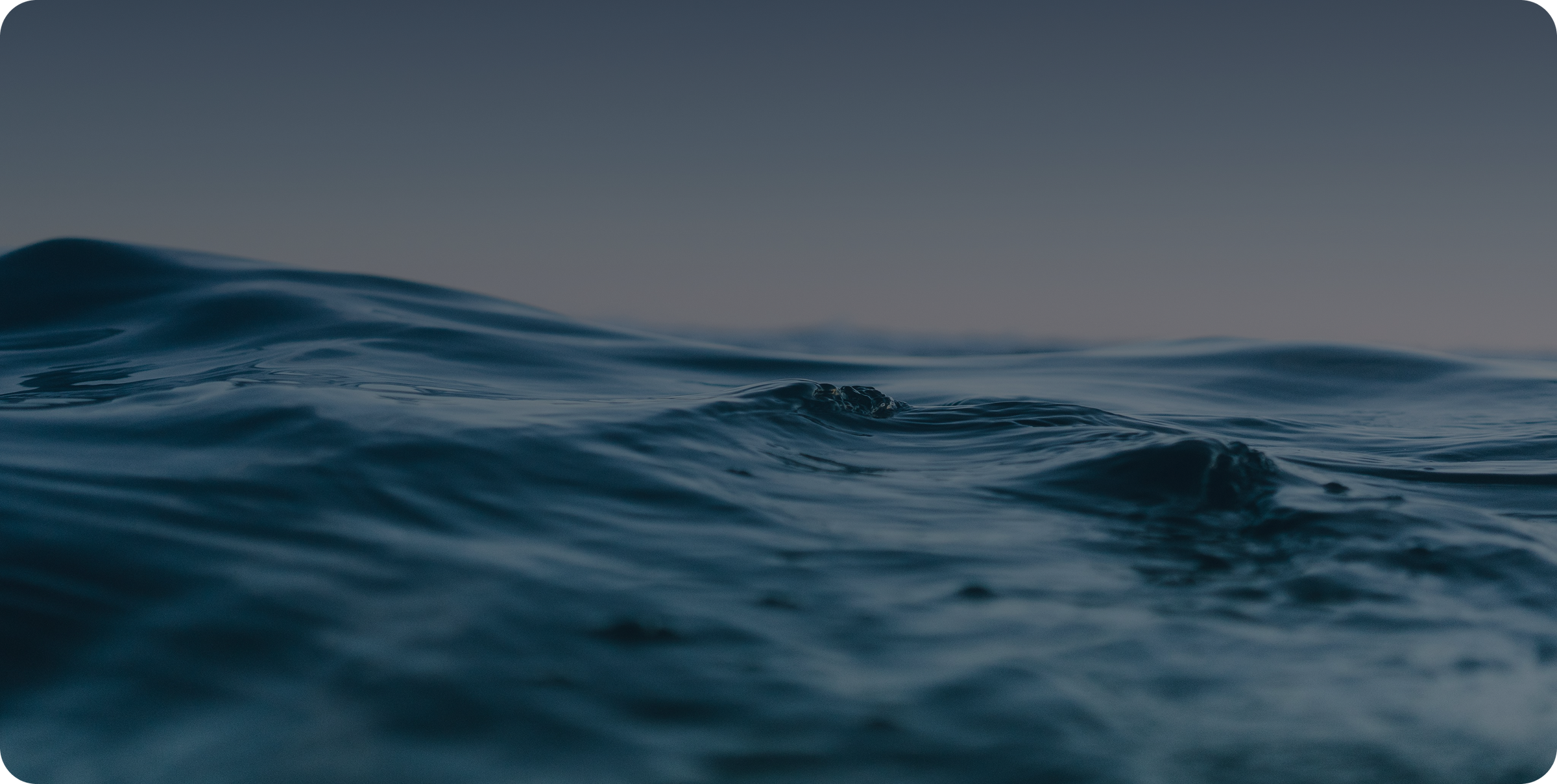 Ocean wave at dusk